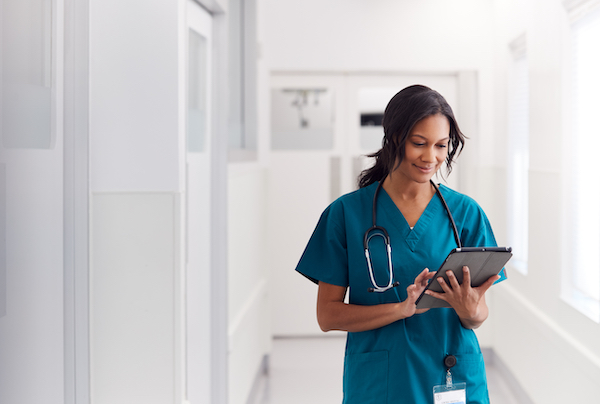 bigstock-Female-Doctor-Wearing-Scrubs-I-349378798